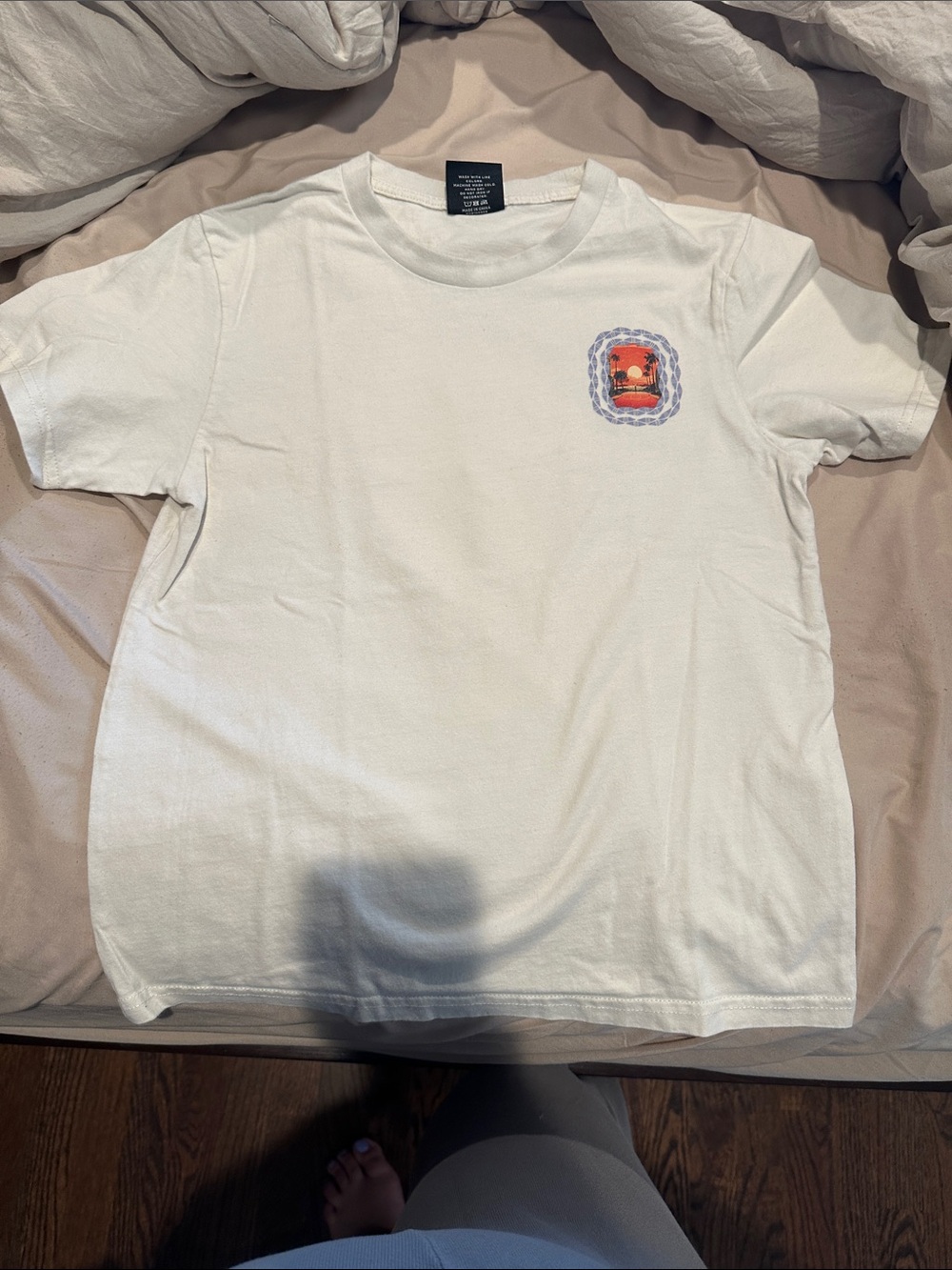 White overtime tee shirt with Orange Sunset Patch and Blue Frame